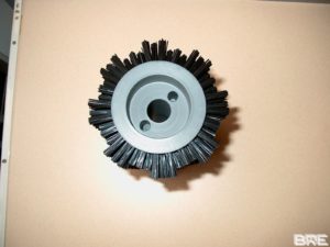 Brosse rotative pour déplacement de produits
