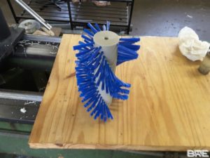 Brosse rotative triple hélice