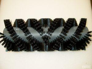 Brosse rotative d'évacuation de produits en vis d'Archimède